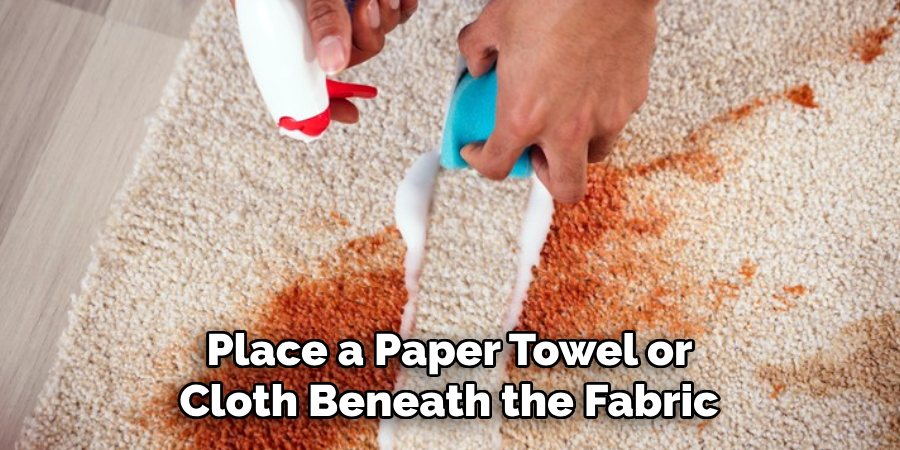 Place a Paper Towel or 
Cloth Beneath the Fabric 