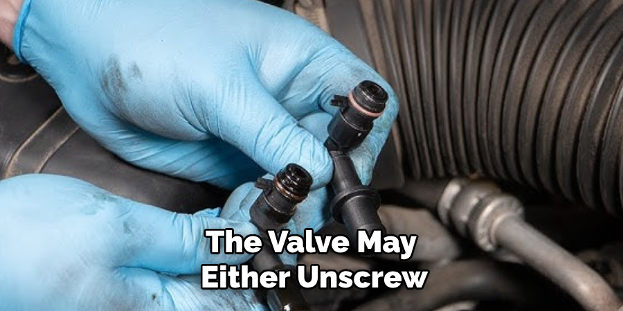 The Valve May 
Either Unscrew