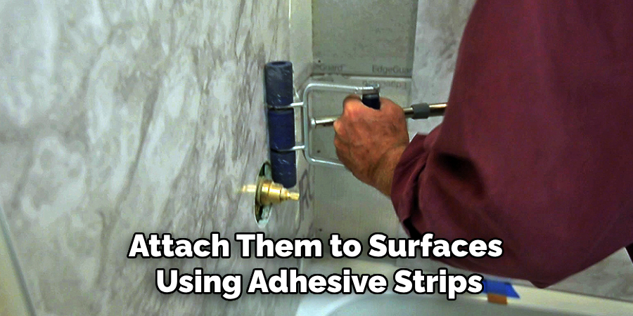 Attach Them to Surfaces
Using Adhesive Strips