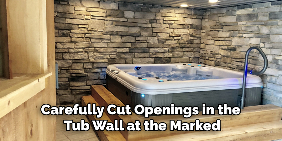 Carefully Cut Openings in the
Tub Wall at the Marked