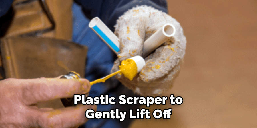 Plastic Scraper to 
Gently Lift Off 