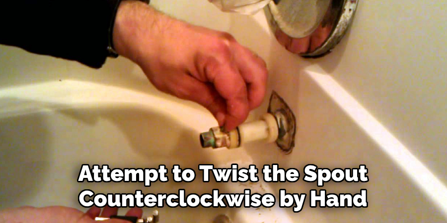 Attempt to Twist the Spout
Counterclockwise by Hand
