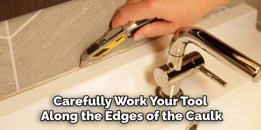 Carefully Work Your Tool
Along the Edges of the Caulk