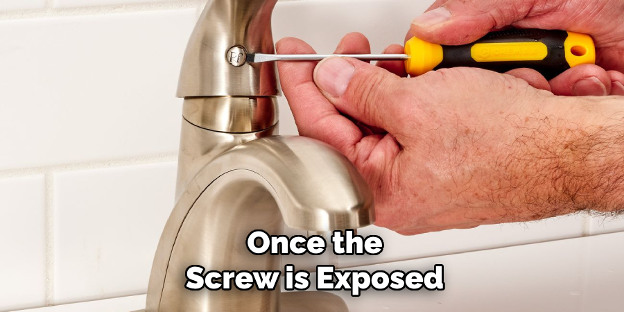 Once the
Screw is Exposed
