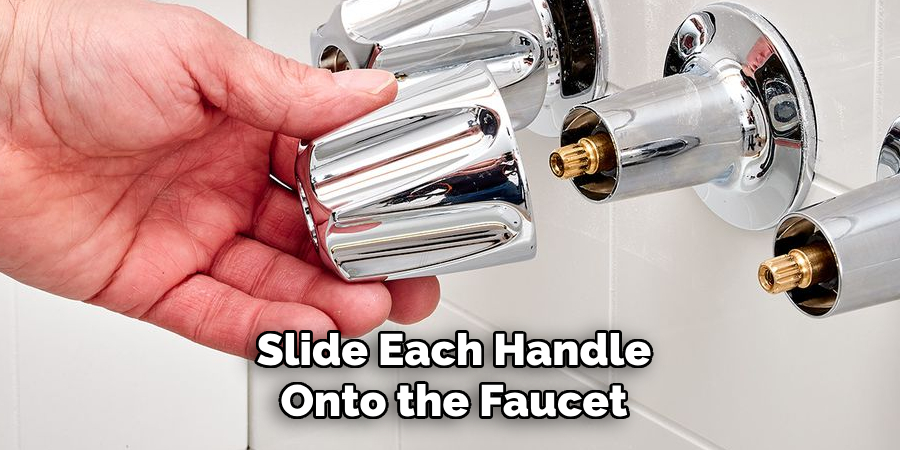 Slide each handle onto the faucet 