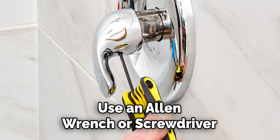 Use an Allen Wrench or Screwdriver