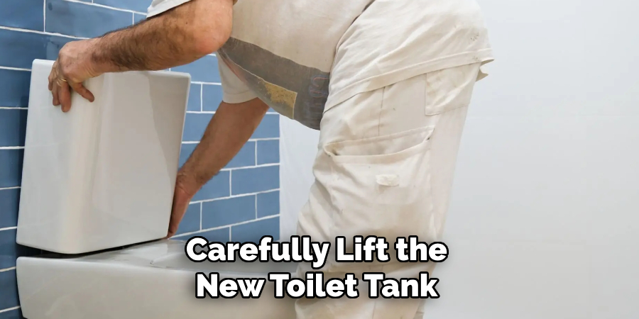 Carefully Lift the
New Toilet Tank