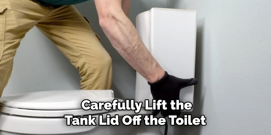 Carefully Lift the
Tank Lid Off the Toilet