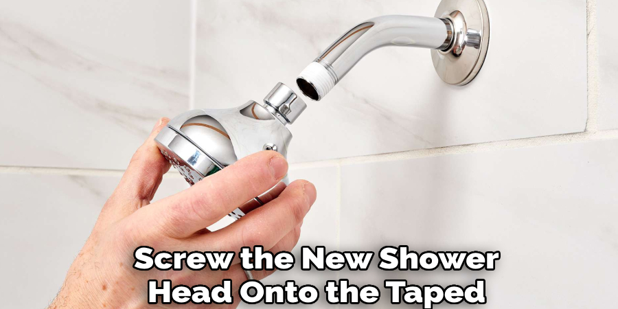 Screw the New Shower
Head Onto the Taped