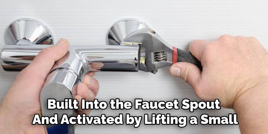 Built Into the Faucet Spout
And Activated by Lifting a Small