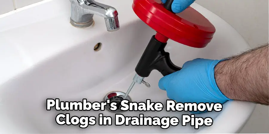 Plumber's Snake to Remove Any Clogs in the Drainage Pipe