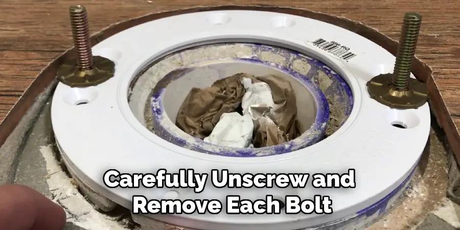 Carefully Unscrew and Remove Each Bolt